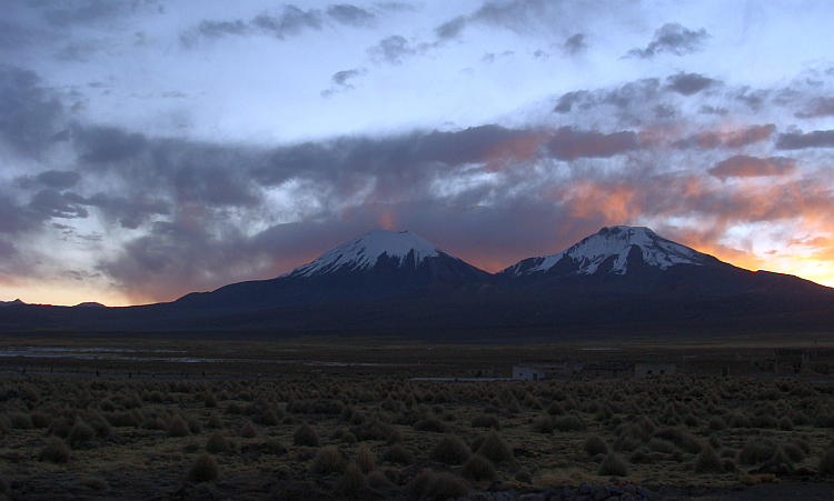 Sunset over the twin vocanoes Parinacota and Pomarape