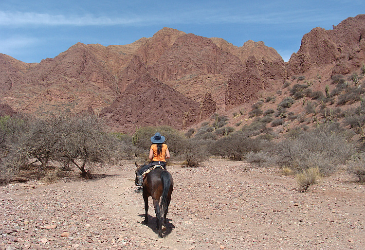 Zia on horseback in the Wild West landscape of Tupiza