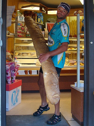 Willem showing a big catch in the boulangerie of Tour d'Auvergne
