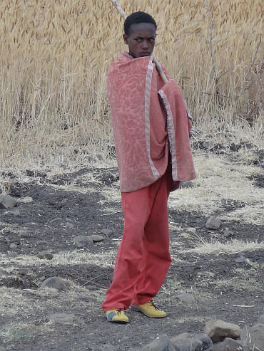 Kind/herder van de hoogvlakte